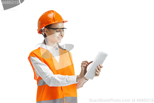 Image of The female builder in orange helmet isolated on white