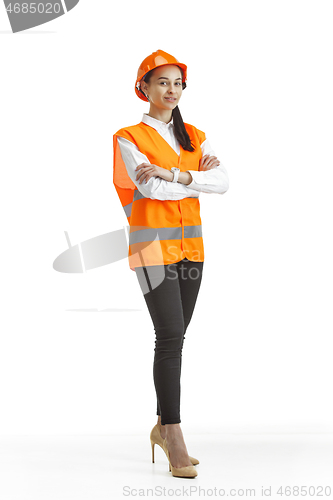 Image of The female builder in orange helmet isolated on white