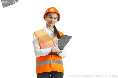 Image of The female builder in orange helmet isolated on white