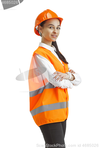 Image of The female builder in orange helmet isolated on white