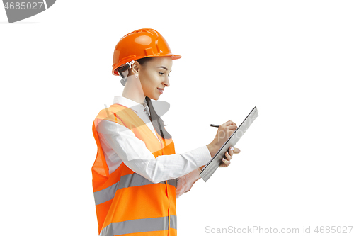 Image of The female builder in orange helmet isolated on white