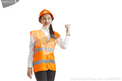 Image of The female builder in orange helmet isolated on white