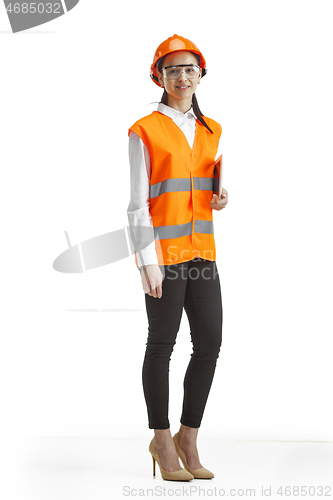 Image of The female builder in orange helmet isolated on white