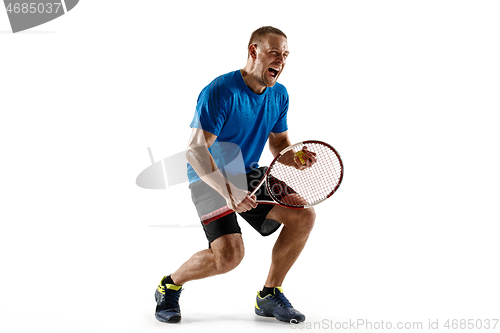 Image of Portrait of a handsome male tennis player celebrating his success isolated on a white background