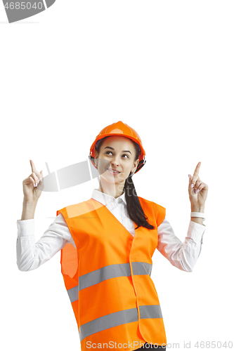 Image of The female builder in orange helmet isolated on white