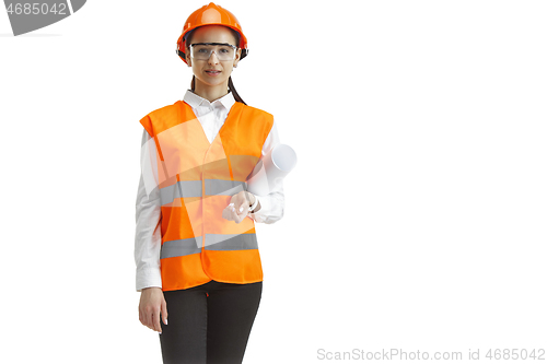 Image of The female builder in orange helmet isolated on white