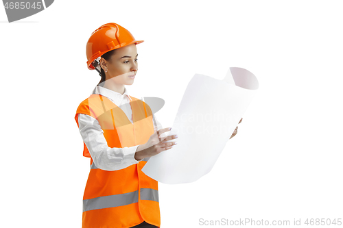Image of The female builder in orange helmet isolated on white