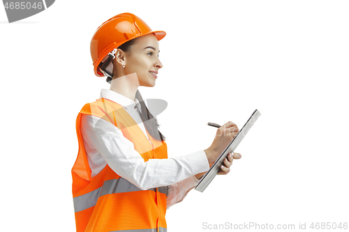 Image of The female builder in orange helmet isolated on white