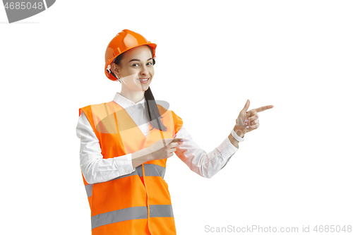 Image of The female builder in orange helmet isolated on white