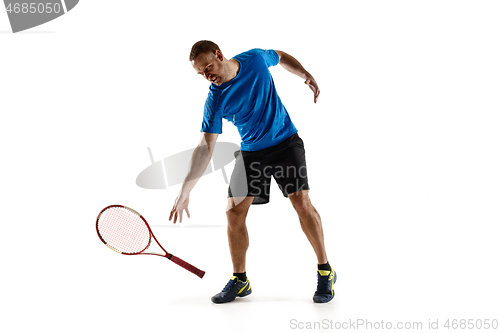 Image of Tennis player crouching down looking defeated and sad
