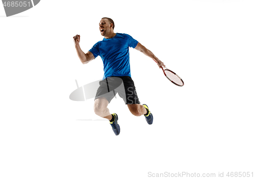 Image of Portrait of a handsome male tennis player celebrating his success isolated on a white background