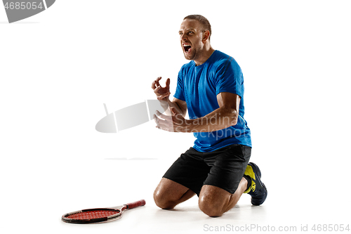 Image of Portrait of a handsome male tennis player celebrating his success isolated on a white background