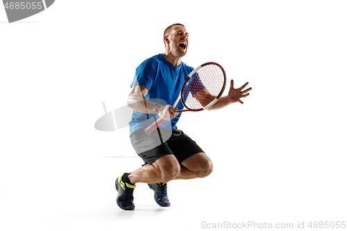 Image of Portrait of a handsome male tennis player celebrating his success isolated on a white background