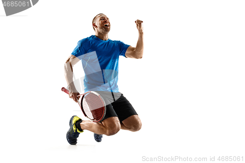 Image of Portrait of a handsome male tennis player celebrating his success isolated on a white background