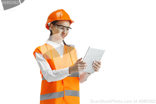 Image of The female builder in orange helmet isolated on white