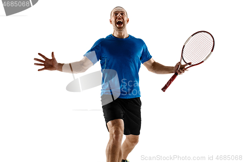 Image of Portrait of a handsome male tennis player celebrating his success isolated on a white background