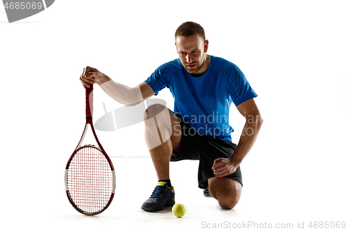 Image of Tennis player crouching down looking defeated and sad