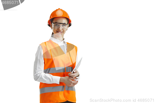 Image of The female builder in orange helmet isolated on white