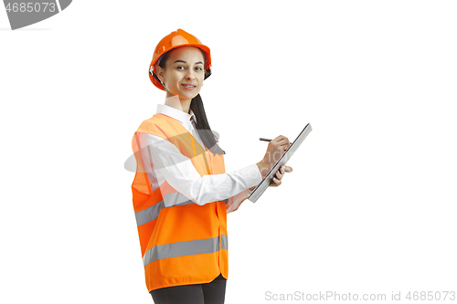 Image of The female builder in orange helmet isolated on white