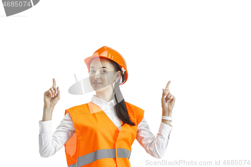 Image of The female builder in orange helmet isolated on white