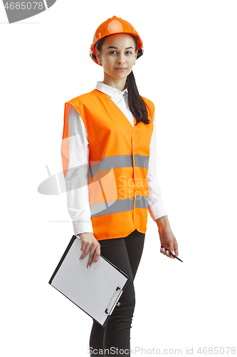 Image of The female builder in orange helmet isolated on white