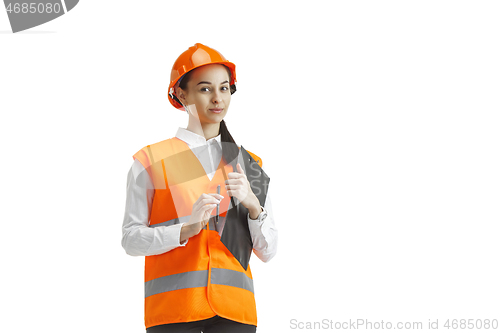 Image of The female builder in orange helmet isolated on white