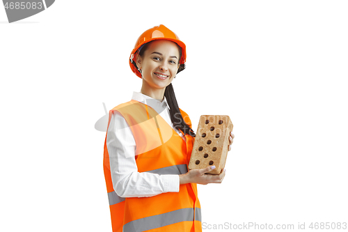 Image of The female builder in orange helmet isolated on white