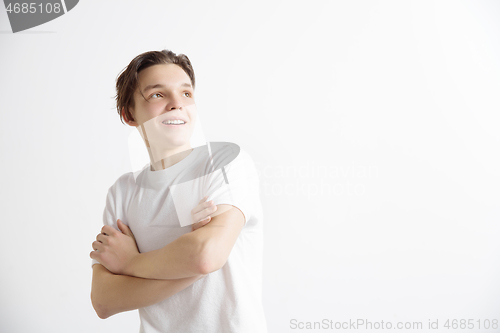 Image of Young dreaming teenager isolated on white background looking at something