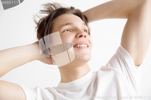 Image of Young dreaming teenager isolated on white background looking at something