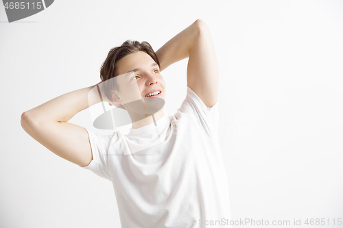 Image of Young dreaming teenager isolated on white background looking at something