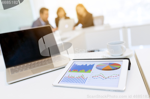 Image of Business meeting with tablet and laptop computer