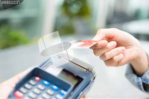 Image of Woman pay with credit card