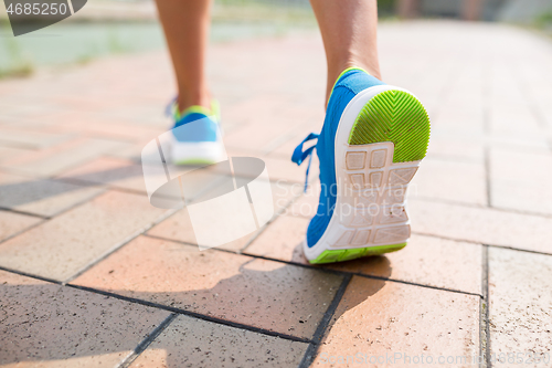 Image of Woman jogging at city