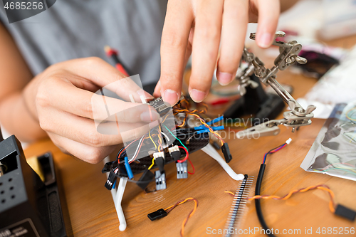 Image of Human combine the drone cable