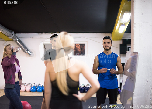 Image of athletes getting instructions from trainer