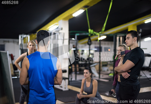 Image of athletes getting instructions from trainer