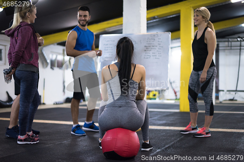 Image of athletes getting instructions from trainer