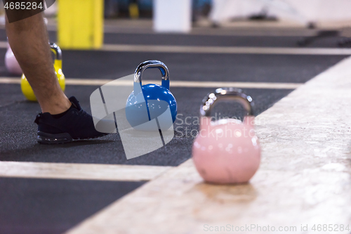 Image of athletes doing exercises with kettlebells