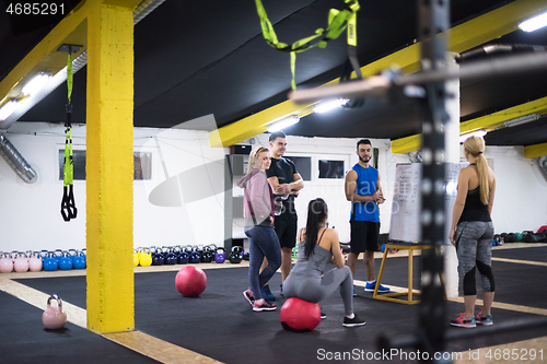 Image of athletes getting instructions from trainer