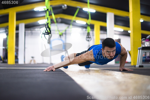 Image of Young  man doing pushups