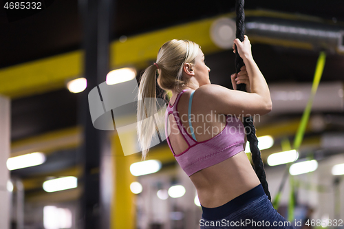 Image of woman doing rope climbing