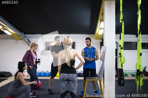 Image of athletes getting instructions from trainer