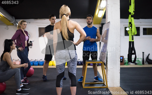 Image of athletes getting instructions from trainer