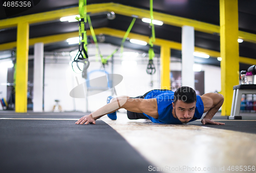 Image of Young  man doing pushups