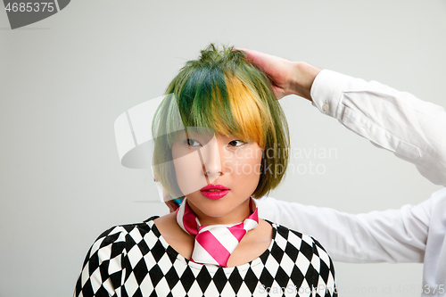 Image of Picture showing adult woman at the hair salon