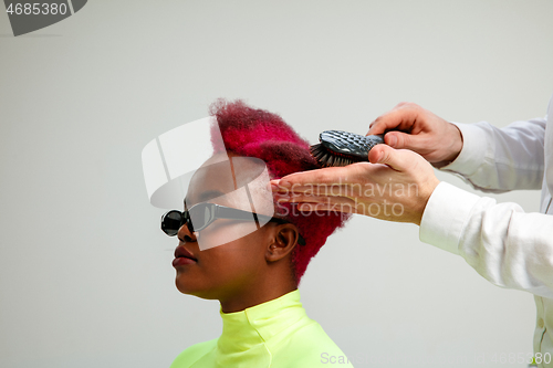 Image of Picture showing adult woman at the hair salon