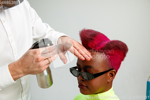 Image of Picture showing adult woman at the hair salon