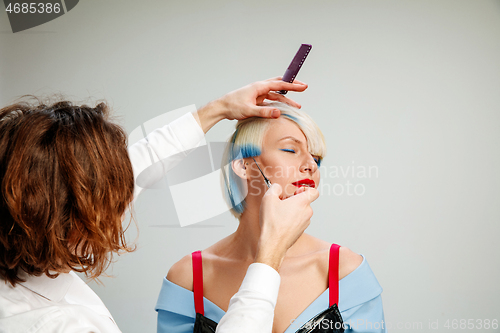 Image of Picture showing adult woman at the hair salon