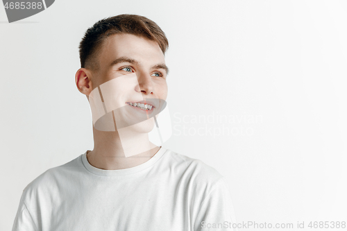 Image of Young dreaming man isolated on white background looking at something