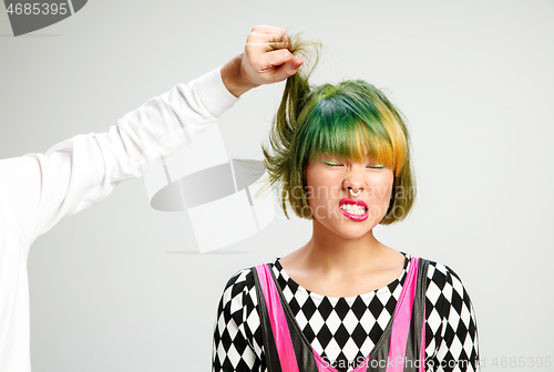 Image of Picture showing adult woman at the hair salon